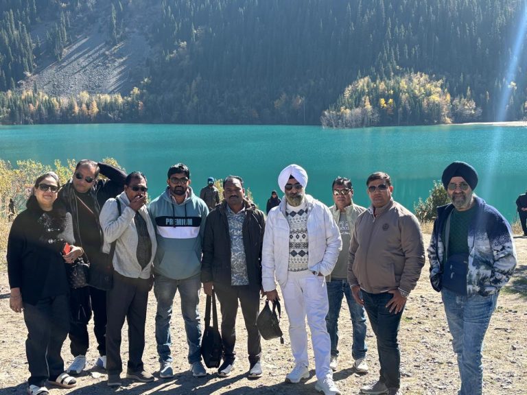 Corporate team enjoying cityscape views and team activities in Almaty